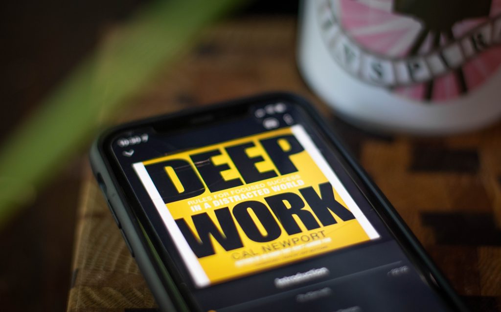 This is a photo of a phone showing the audiobook "Deep work"