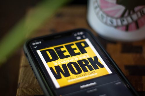 This is a photo of a phone showing the audiobook "Deep work"