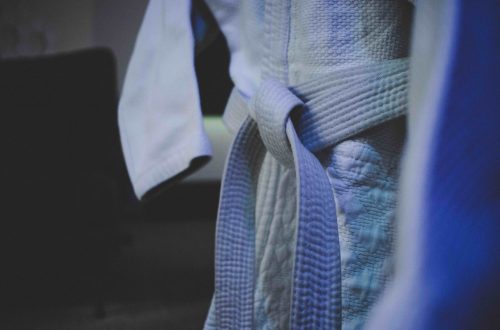 This is a close up of a judogi with a white belt